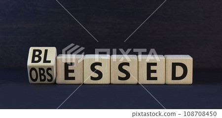 Blessed or obsessed symbol. Turned wooden cubes and changed the concept word Obsessed to Blessed. Beautiful black table black background. Business blessed or obsessed concept. Copy space. Blessed or obsessed symbol. Turned wooden cubes and changed the concept word Obsessed to Blessed. Beautiful black table black background. Business blessed or obsessed concept. Copy space. 108708450