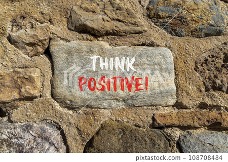 Think positive symbol. Concept words Think positive on beautiful grey stone. Beautiful brown stone wall background. Business, motivational think positive thinking concept. Copy space. Think positive symbol. Concept words Think positive on beautiful grey stone. Beautiful brown stone wall background. Business, motivational think positive thinking concept. Copy space. 108708484