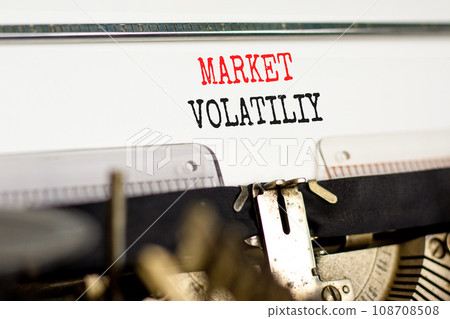 Market volatility symbol. Concept words Market volatility typed on beautiful old retro typewriter. Beautiful white paper background. Business market volatility concept. Copy space.orange 108708508