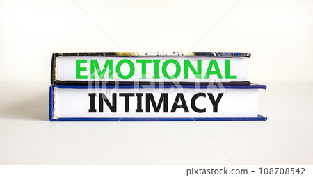 Emotional intimacy symbol. Concept words Emotional intimacy on beautiful books. Beautiful white table white background. Psychology emotional intimacy concept. Copy space. Emotional intimacy symbol. Concept words Emotional intimacy on beautiful books. Beautiful white table white background. Psychology emotional intimacy concept. Copy space. 108708542