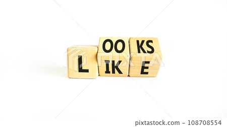 Looks like symbol. Concept words Looks like on wooden cubes. Beautiful white table white background. Business, popular quotes and looks like concept. Copy space. 108708554