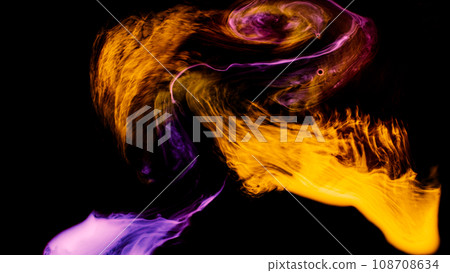 A watercolor abstract background image that looks like a mysterious flame glowing on a black background. A watercolor abstract background image that looks like a mysterious flame glowing on a black background. 108708634