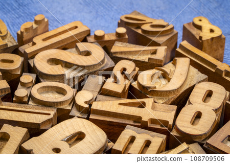 random letterpress wood type printing blocks against handmade textured paper random letterpress wood type printing blocks against handmade textured paper 108709506