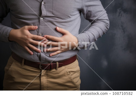 Fat man holds his stomach with his hands. Generative AI 108710582
