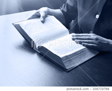 Woman's hands holding a bible Woman's hands holding a bible 108710766