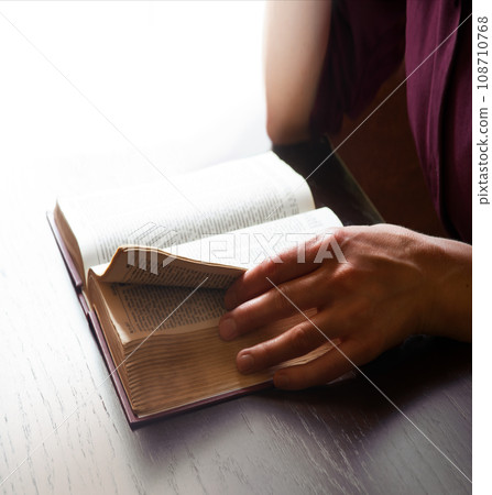 Woman's hands holding a bible Woman's hands holding a bible 108710768