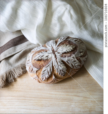 Fresh bread with leaf pattern Fresh bread with leaf pattern 108710804