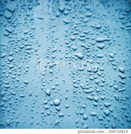 Raindrops on the hood of a car Raindrops on the hood of a car 108710824