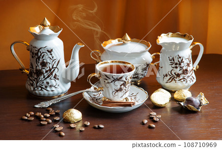 Sweets on the background of coffee still life Sweets on the background of coffee still life 108710969
