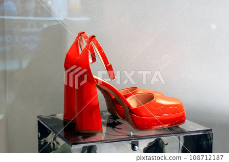 Bright red shoes closeup on gray background Bright red shoes closeup on gray background 108712187