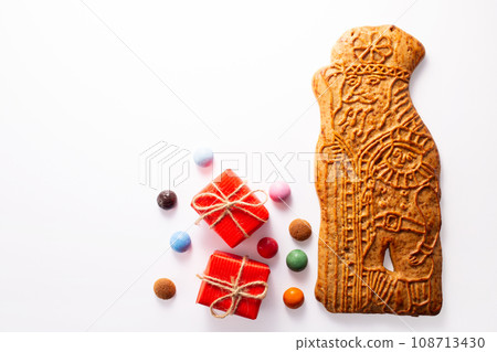 St. Nicolas biscuite and traditional dutch coocies on white background. 5th December holiday in the Netherlands St. Nicolas biscuite and traditional dutch coocies on white background. 5th December holiday in the Netherlands 108713430