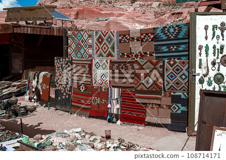 View of an open-air souvenir shop located along the Siq Canyon in the city of Petra, Jordan. View of an open-air souvenir shop located along the Siq Canyon in the city of Petra, Jordan. 108714171