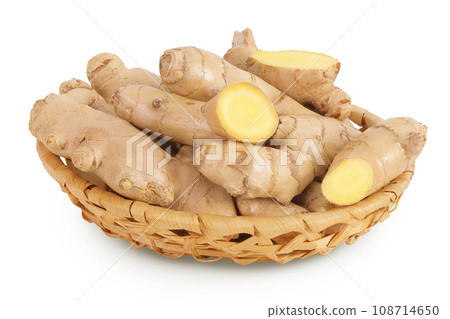 Fresh Ginger root and slices in a wicker basket isolated on white background Fresh Ginger root and slices in a wicker basket isolated on white background 108714650