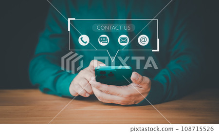 Contact us support hotline, people connect. Man using a smartphone with virtual screen member contact icons ( phone, email, address, live chat). Customer service, helpdesk advice online support. Contact us support hotline, people connect. Man using a smartphone with virtual screen member contact icons ( phone, email, address, live chat). Customer service, helpdesk advice online support. 108715526
