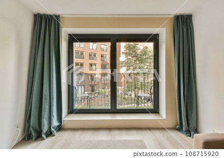 a living room with an open window and sliding glass door that opens to the patio area, which has been used for several years a living room with an open window and sliding glass door that opens to the patio area, which has been used for several years 108715920