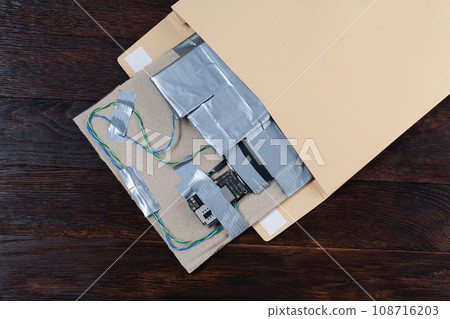 Mail bomb IED - Improvised Explosive Device with C-4 explosive and cell phone module in envelope 108716203