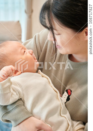 Mother comforting a crying baby, childcare, crying, holding Mother comforting a crying baby, childcare, crying, holding 108717827