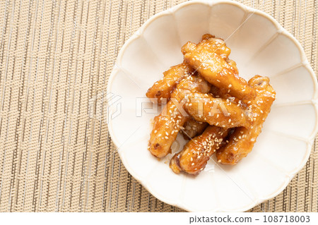 Homemade chicken wings boiled in sweet and spicy sauce Homemade chicken wings boiled in sweet and spicy sauce 108718003
