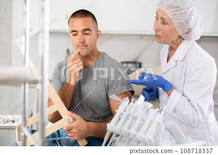 Female cosmetologist confidently presents 108718337