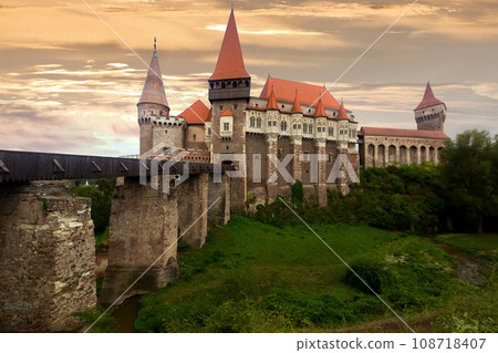 Corvin Castle is on the green mountain 108718407