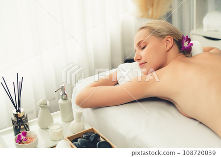 Caucasian woman customer enjoying relaxing anti-stress massage. Quiescent Caucasian woman customer enjoying relaxing anti-stress massage. Quiescent 108720039