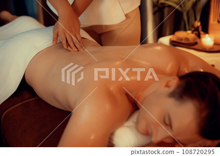 Caucasian man customer enjoying relaxing anti-stress massage. Quiescent 108720295