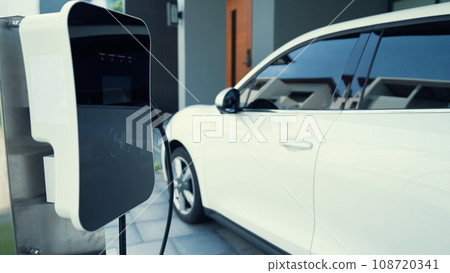 Progressive concept of home charging station providing clean energy for EV cars. Progressive concept of home charging station providing clean energy for EV cars. 108720341