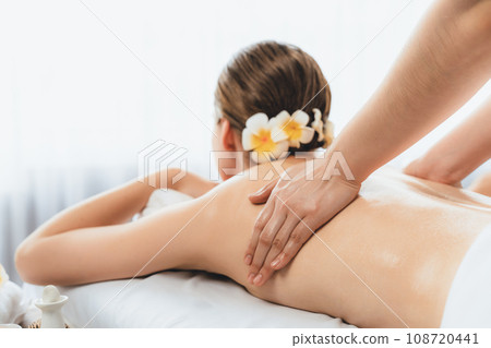 Caucasian woman customer enjoying relaxing anti-stress massage. Quiescent 108720441