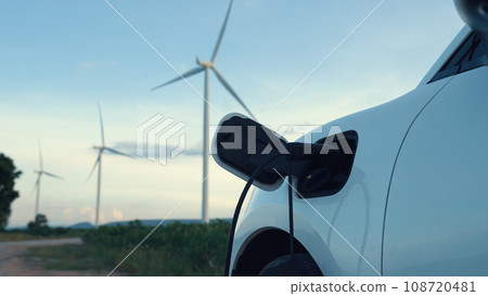 Progressive combination of EV car, charging station and wind turbine. 108720481