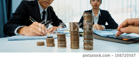 Growth coin stack symbolizing business investment. Shrewd Growth coin stack symbolizing business investment. Shrewd 108720587