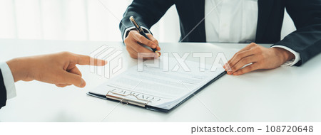 Business executive signing contract agreement document. Shrewd Business executive signing contract agreement document. Shrewd 108720648