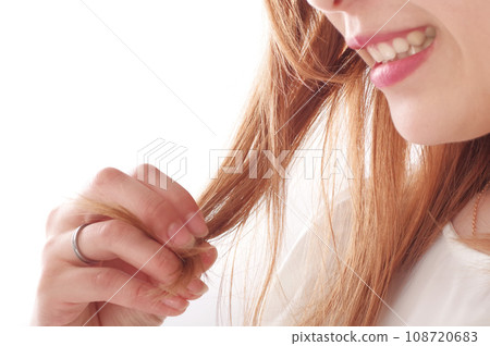 A young woman who is happy with her smooth hair A young woman who is happy with her smooth hair 108720683
