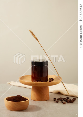 Beauty product for packaging design displayed on wooden tray with coffee beans and coffee powder on beige background. Minimal scene for branding product for body care with coffee ingredient 108722632