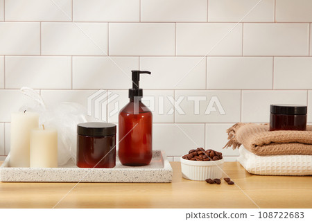 Set of hair cosmetic bottles placed on marble tray with bathroom objects and coffee beans on ceramic background. Minimal scene for advertising and branding cosmetic product with space for design 108722683