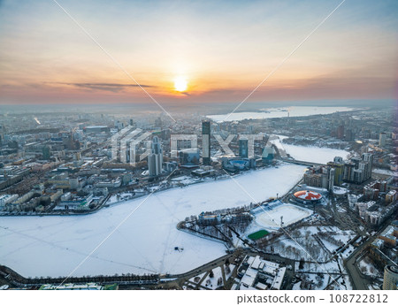 Embankment of the central pond and Plotinka in Yekaterinburg at winter sunset. The historic center of the city of Yekaterinburg, Russia, Aerial View 108722812