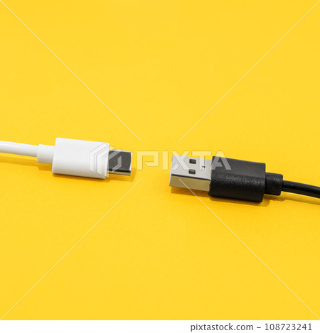 USB cable, type C cable over yellow background 108723241