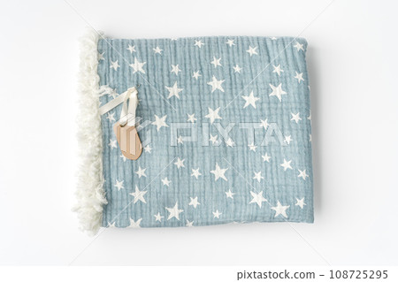 Muslin blanket with star pattern on white background 108725295