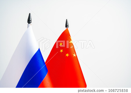 Russian and Chinese flags on negotiation table 108725838