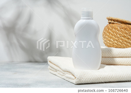 White cosmetics container mockup with towels on gray background White cosmetics container mockup with towels on gray background 108726640