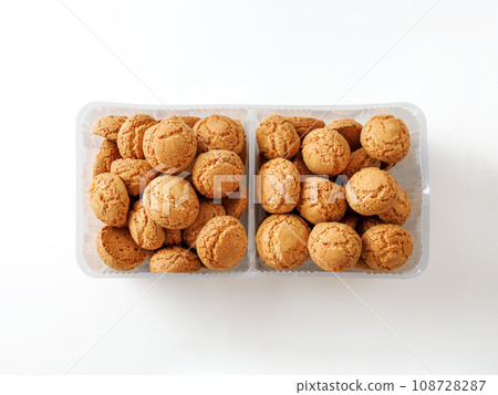 Box of cookie amaretti on white background - traditional Italian Sardinian pastry. Delicious amaretti biscuit cookies with copy space 108728287