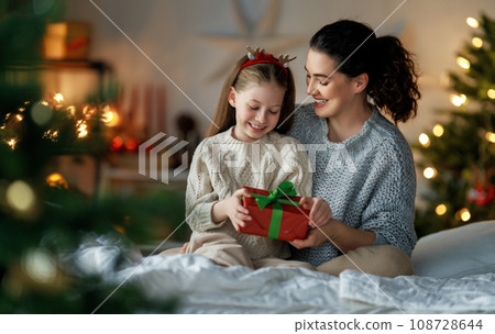family celebrating Christmas 108728644