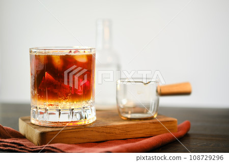 Glass with shiny coffee with tonic 108729296