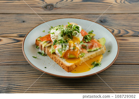 Sandwich with trout and poached egg Sandwich with trout and poached egg 108729302