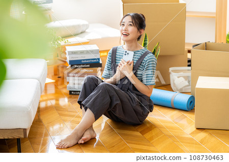 Young woman packing Young woman packing 108730463