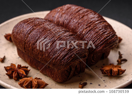 Delicious sweet crispy puff pastry with chocolate filling Delicious sweet crispy puff pastry with chocolate filling 108730539