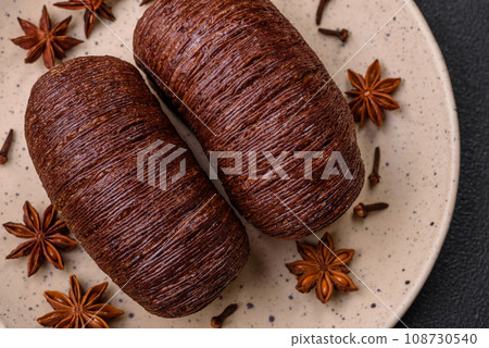 Delicious sweet crispy puff pastry with chocolate filling Delicious sweet crispy puff pastry with chocolate filling 108730540