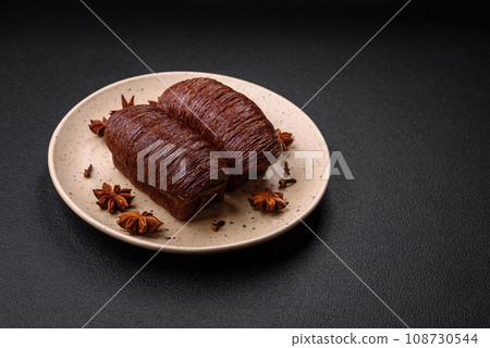 Delicious sweet crispy puff pastry with chocolate filling 108730544