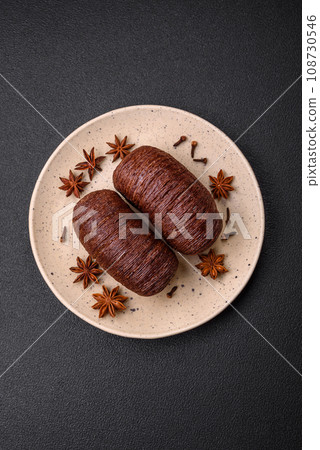 Delicious sweet crispy puff pastry with chocolate filling Delicious sweet crispy puff pastry with chocolate filling 108730546