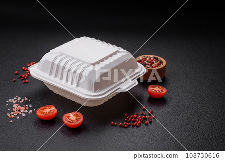 Square plastic or cardboard container of white color for food 108730616