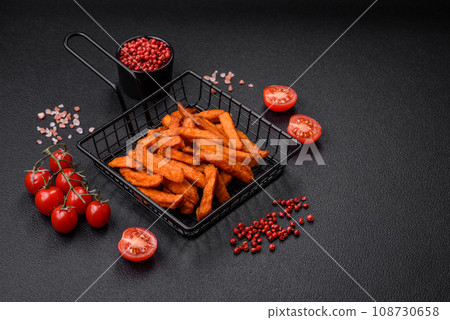 Delicious crispy sweet potato fries with salt, spices and herbs Delicious crispy sweet potato fries with salt, spices and herbs 108730658